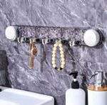 PERCHERO ACRÍLICO CON VENTOSA Y GANCHO PLEGABLE  - Imagen 2